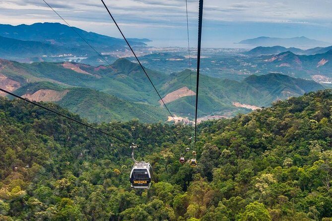 Afternoon private transfer from Danang city to the Golden Bridge - Cable car ride and first views: hands, flowers, and cloud cover